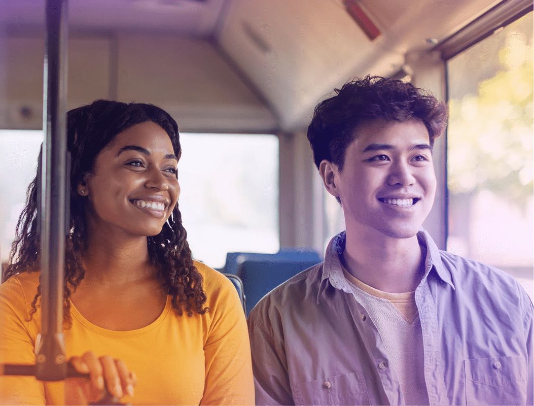 Woman and man sitting on a bus